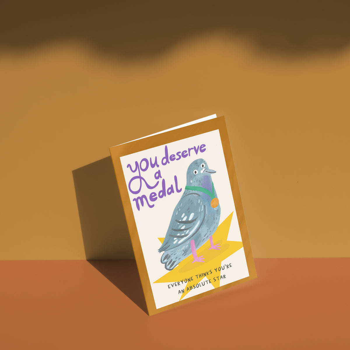 You Deserve A Medal (Pigeon) greetings card