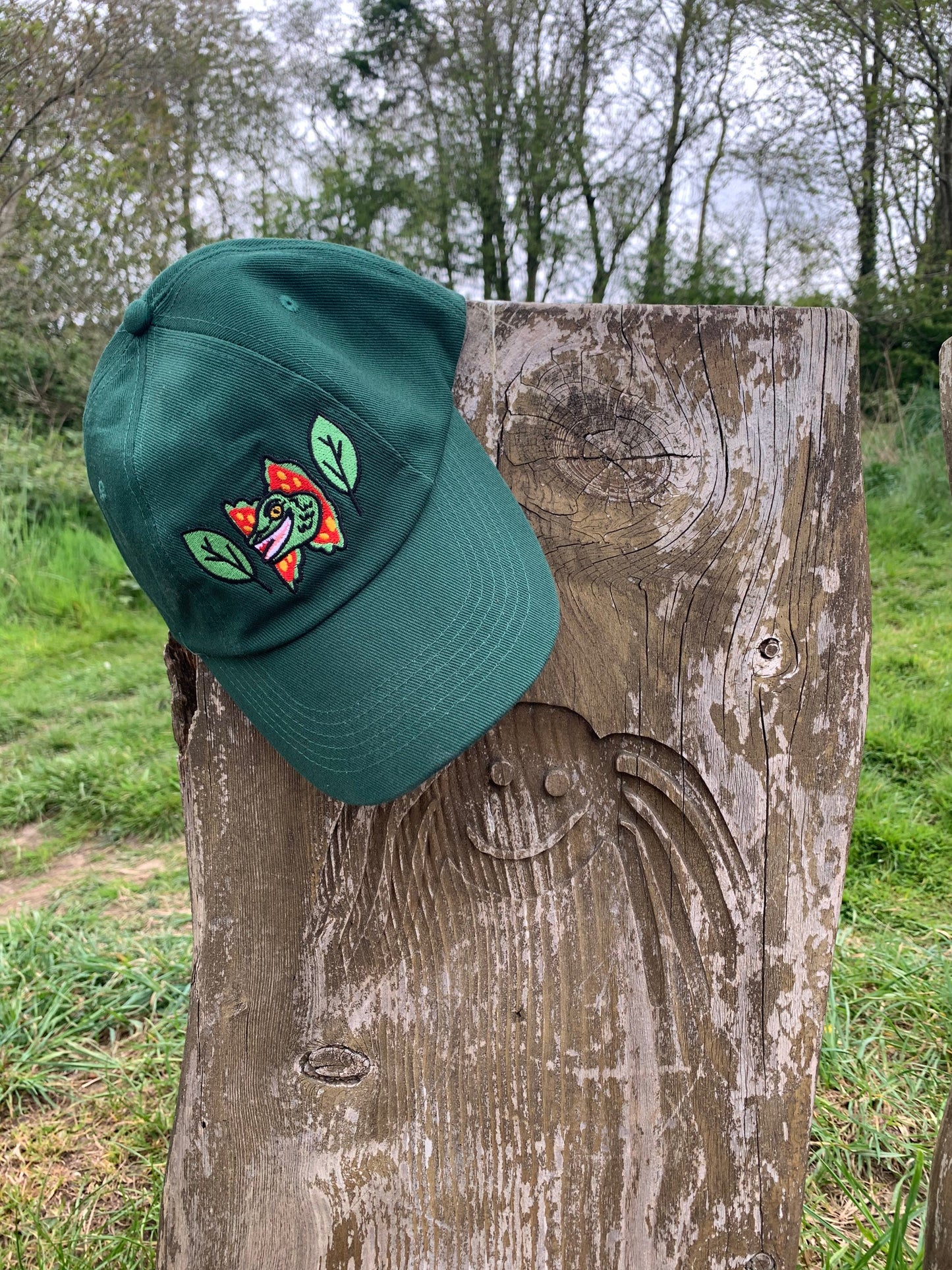 Happy Dilophosaurus Dinosaur embroided cotton drill CAP with leaves inspired by Jurassic Park in Forest (Dark) Green - Fernandes Makes