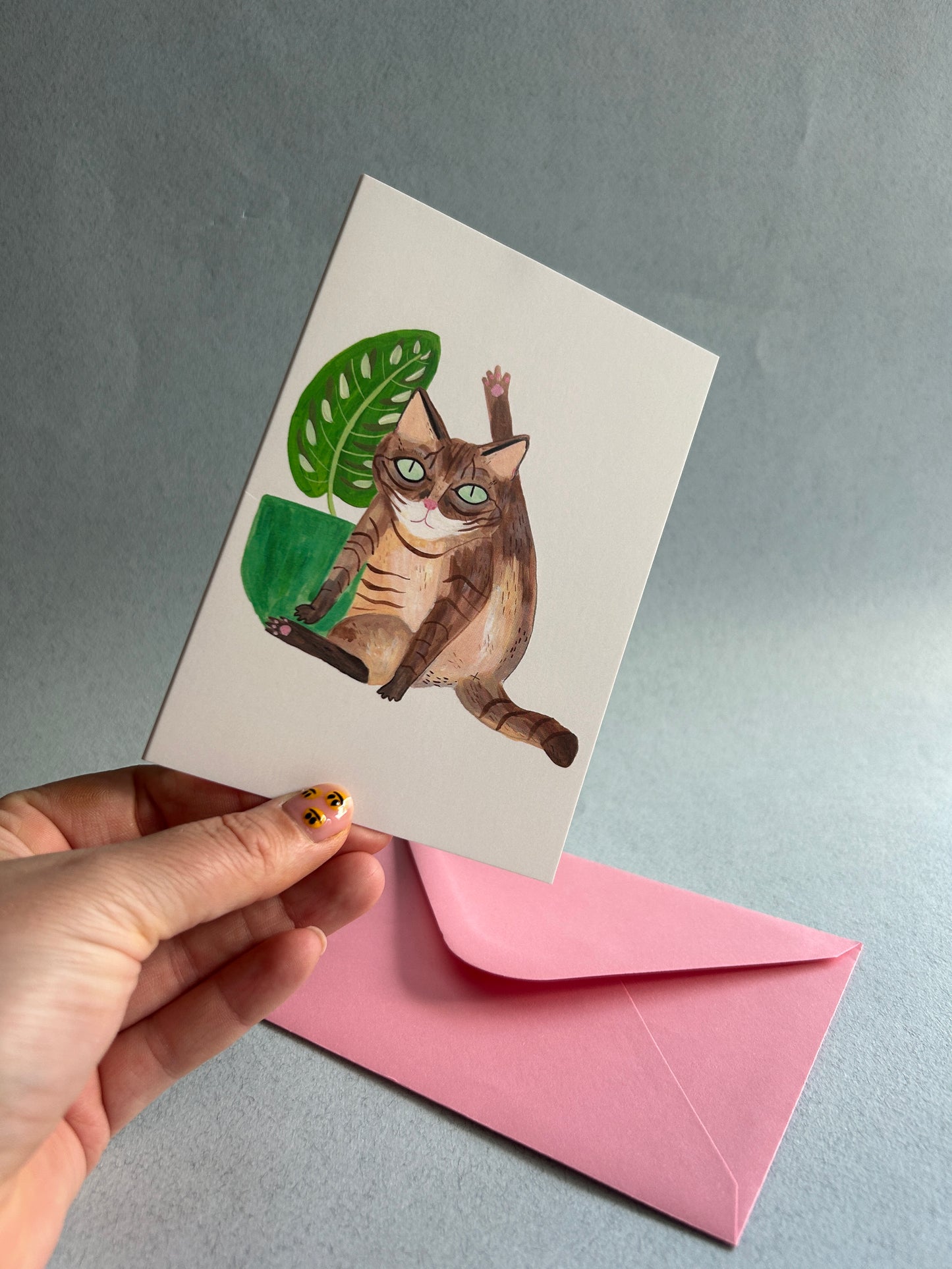 Cat licking Greetings Card