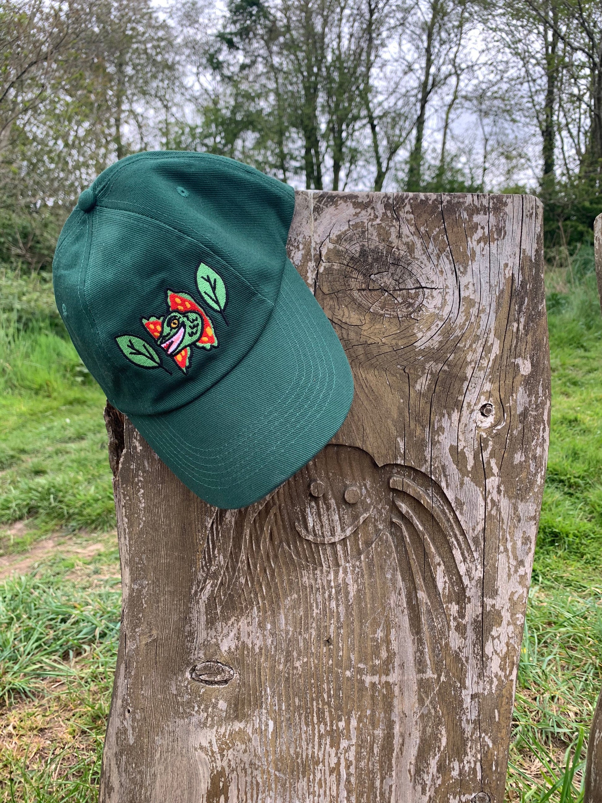 Happy Dilophosaurus Dinosaur embroided cotton drill CAP with leaves inspired by Jurassic Park in Forest (Dark) Green - Fernandes Makes