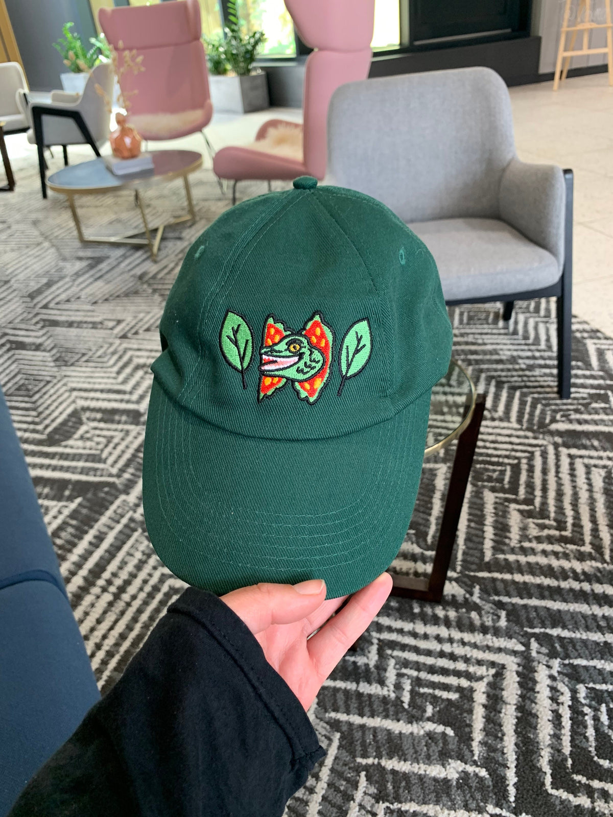 Happy Dilophosaurus Dinosaur embroided cotton drill CAP with leaves inspired by Jurassic Park in Forest (Dark) Green - Fernandes Makes